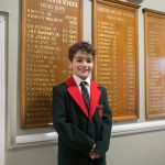 boy standing happily