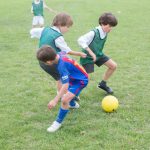 students playing football