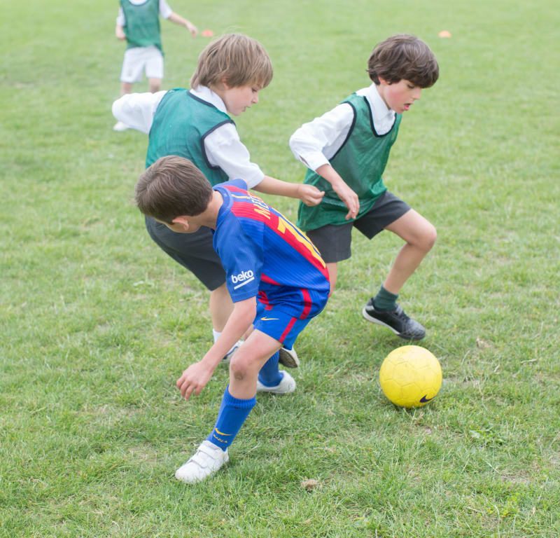 students playing football
