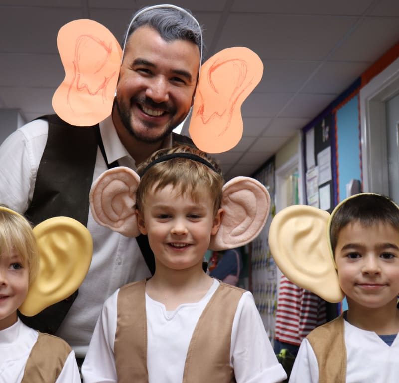 students wearing big ear props